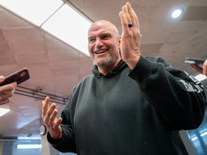 US Senator John Fetterman (D-PA) speaks to reporters as he goes to vote on the Laken Riley