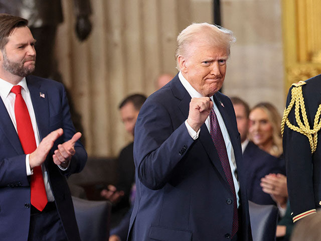 US Vice President J.D. Vance applauds as President Donald Trump gestures after being sworn