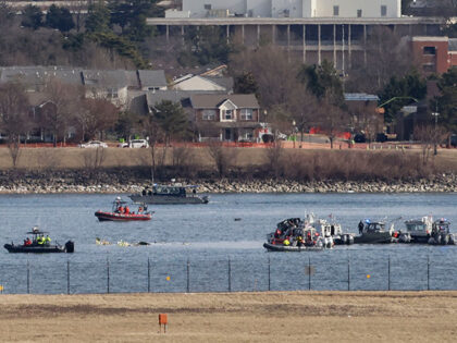 Emergency crews respond to the crash site along the Potomac River after a passenger jet co