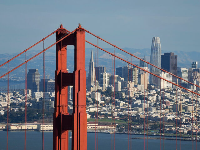 The San Francisco skyline is seen behind the Golden Gate Bridge in this view from the Mari