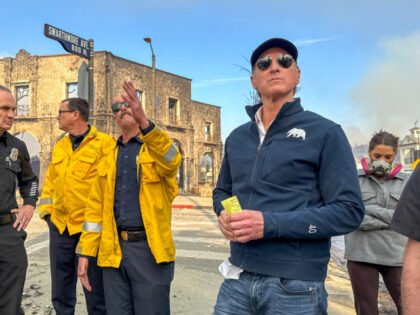 California Governor Gavin Newsom, right, surveys damage in Pacific Palisades with CalFire&