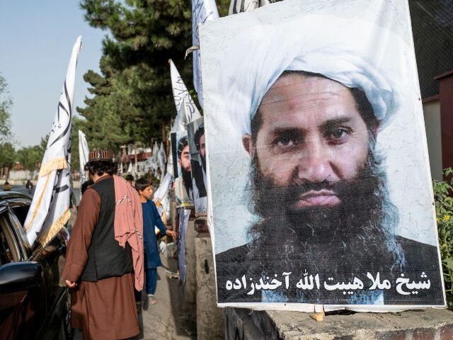 A poster of Taliban Supreme Leader Hibatullah Akhundzada is seen along a road in Kabul on