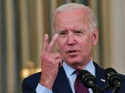 US President Joe Biden gestures as he delivers remarks on the debt ceiling from the State