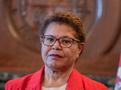 Los Angeles Mayor Karen Bass listens as SEIU Local 99 Executive Director Max Arias and and