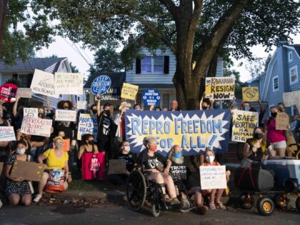 Protesters gather outside the home of Supreme Court Justice Brett Kavanaugh, Monday, Sept.