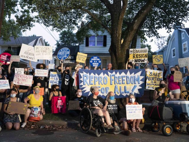 Protesters gather outside the home of Supreme Court Justice Brett Kavanaugh, Monday, Sept.