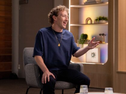 Mark Zuckerberg shows off his pendant