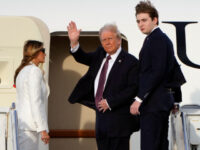 Donald, Melania, Barron Trump Board Plane for D.C. Ahead of Inauguration