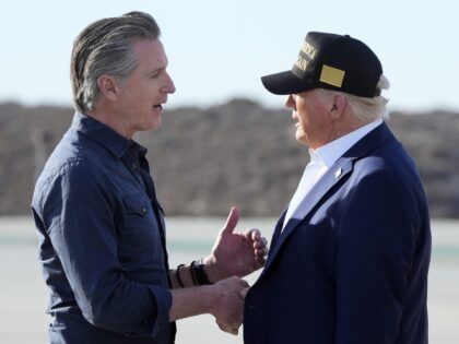 President Donald Trump talks with California Gov. Gavin Newsom after arriving on Air Force