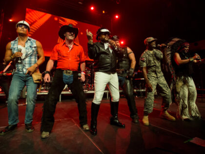 Lead singer and original member Victor Willis (3L) performs with the Village People at the