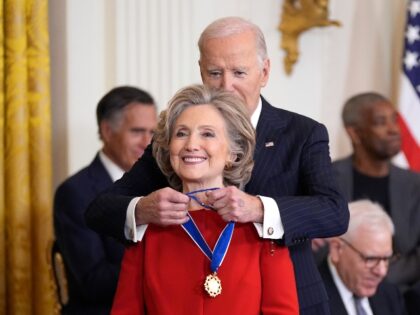 President Joe Biden, right, presents the Presidential Medal of Freedom, the Nation's