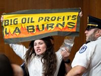 Climate Protesters Disrupt Confirmation Hearing for Trump’s Energy Secretary Pick