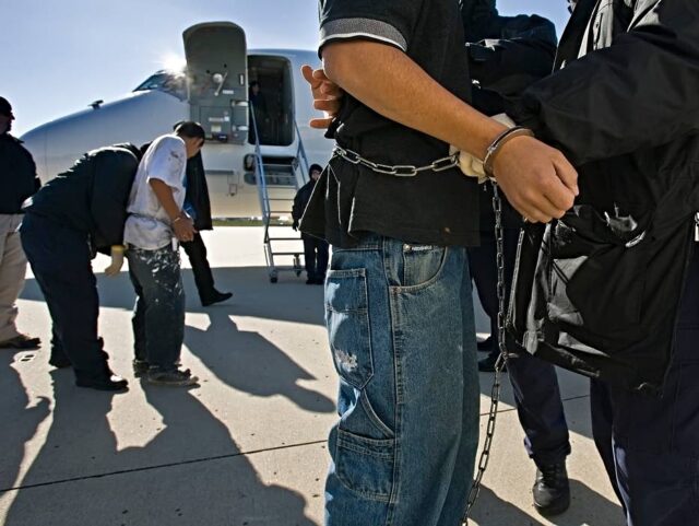 Undocumented immigrants, shackled at the wrists and ankles, were searched before boarding