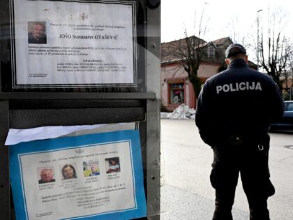 A policeman stands behind a public board bearing death notices, three days after a gunman