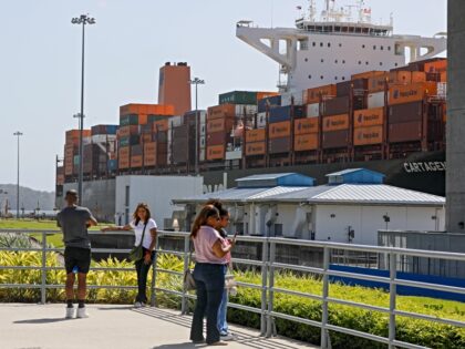 PANAMA CITY, PANAMA - JANUARY 20: People pose by the ships at the Panama Canal in Panama C