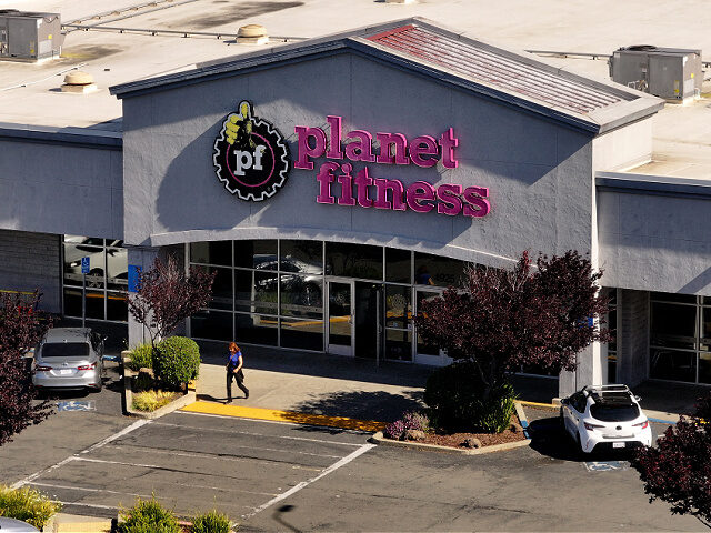 RICHMOND, CALIFORNIA - MAY 09: In an aerial view, a customer leaves a Planet Fitness gym o