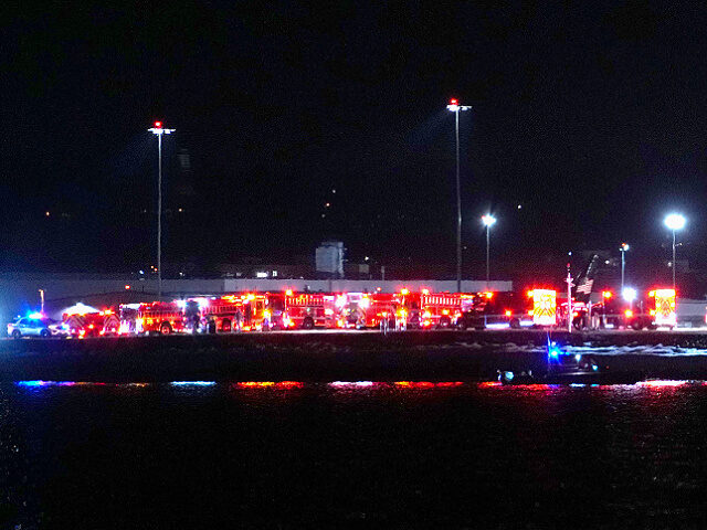 WASHINGTON, DC - JANUARY 30: Emergency response units wait on the tarmac as search and res