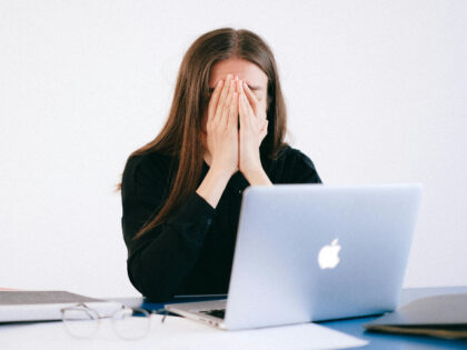 sad woman in front of computer