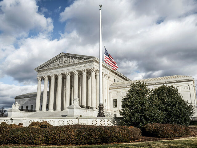 US Supreme Court Building with flag half staff