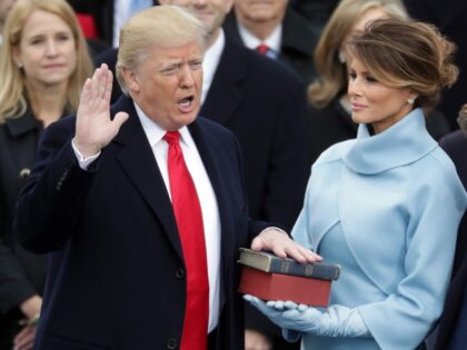 WASHINGTON, DC - JANUARY 20: (L-R) U.S. President Donald Trump takes the oath of office as