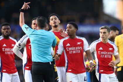 Arsenal's Myles Lewis-Skelly (2nd right) was controversially sent off at Wolves