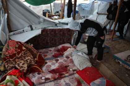 Blood-stained mattresses inside a tent following an overnight Israeli strike in the southe