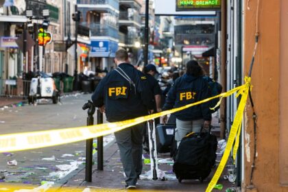 FBI investigators scour the New Orleans scene of a mass casualty attack by a man in a Ford