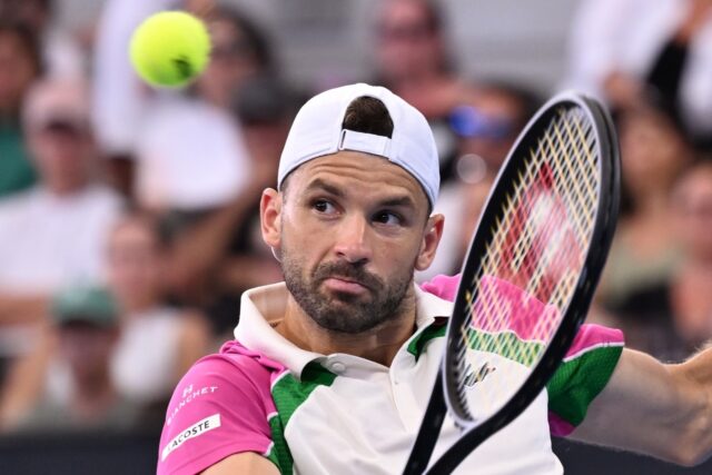 Grigor Dimitrov hits a return in the semi-final against Jiri Lehecka