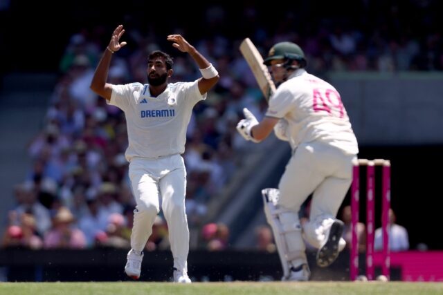 India’s captain Jasprit Bumrah (L) reacts after Australia’s Steve Smith hit a shot dur