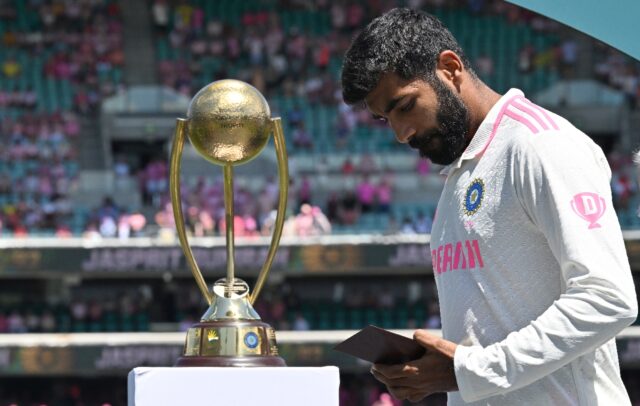 India’s Jasprit Bumrah looks at his Player of the Series award after the fifth and final