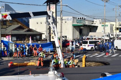 Japanese emergency services have been working to rescue a truck driver whose vehicle plung