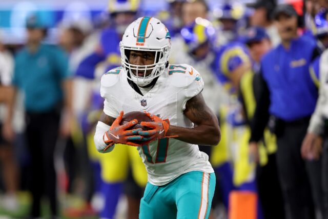 Jaylen Waddle of the Miami Dolphins runs with the ball during a game against the Los Angel