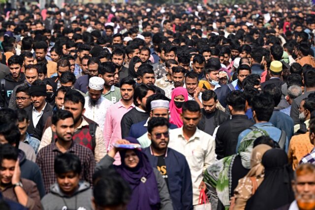 Job applicants leave an exam center after a written test in Dhaka. Some who helped overthr