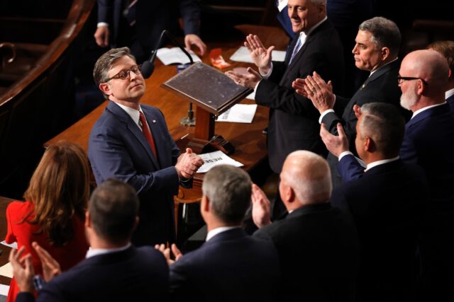 Mike Johnson, seen receiving applause after being re-elected speaker of the US House of Re