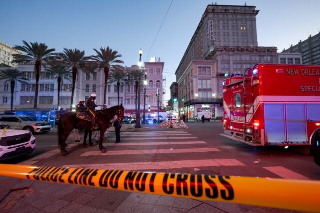 Early morning on New Year's Day as police cordon off the intersection of Canal Street and