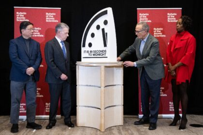 Former President of Colombia Juan Manuel Santos (second to left) and other experts unveil