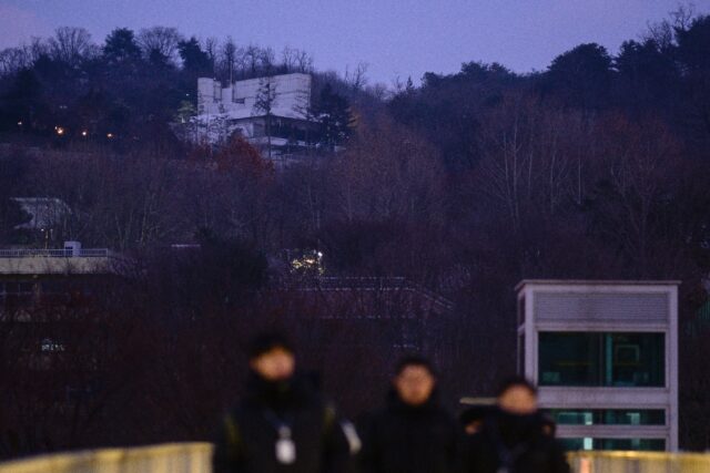 The residence (top) of South Korea's impeached President Yoon Suk Yeol is seen in Seoul be