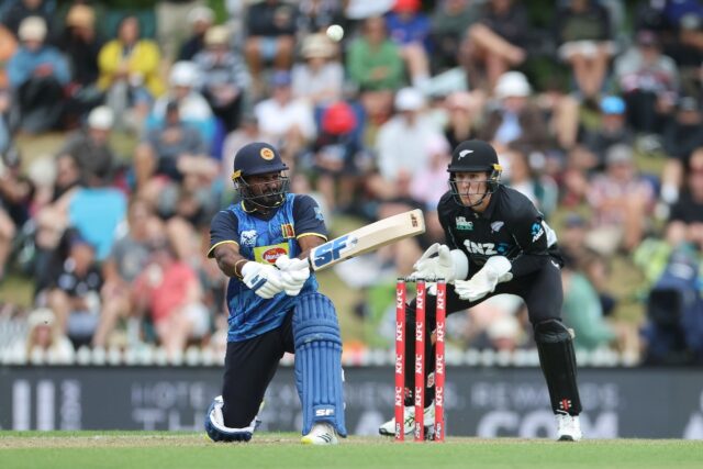 Sri Lanka's Kusal Perera plays a shot as New Zealand wicketkeeper Mitch Hay looks on durin