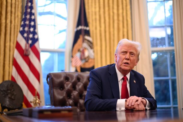 US President Donald Trump speaks to journalists in the Oval Office of the White House in W