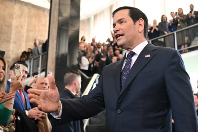 US Secretary of State Marco Rubio greets employees upon arrival at the State Department on