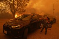 Homes were burning and roads already jammed when Pacific Palisades evacuation order came, AP finds