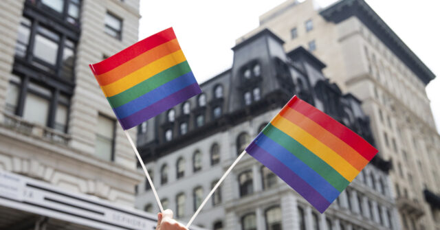 lgbtq-corporate-equality-person-holds-up