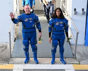 Stranded astronauts Williams, Wilmore perform first spacewalk together