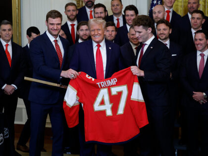 WASHINGTON, DC - FEBRUARY 03: U.S. President Donald Trump receives a jersey and a hockey s