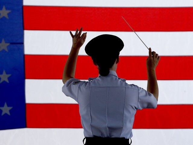 AP18185794955864 Conductor Heather Pickett directs the band during an Independence Day concert by the Ameri