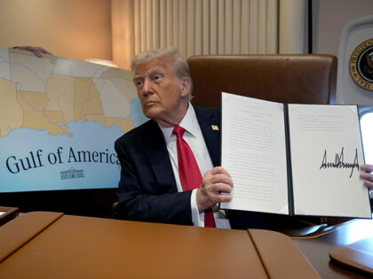 President Donald Trump holds up a signed proclamation declaring Feb. 9 Gulf of America Day