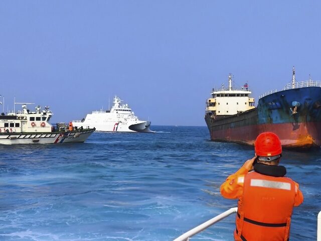 AP25056393086001-2 In this photo released by the Taiwan Coast Guard, Taiwanese Coast Guard vessels prepare to