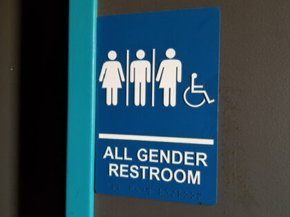 Close-up of sign for all gender restroom in Dublin, California, with male, female and gend