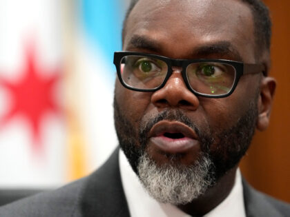 Chicago Mayor Brandon Johnson responds to a question in his City Hall office during an int