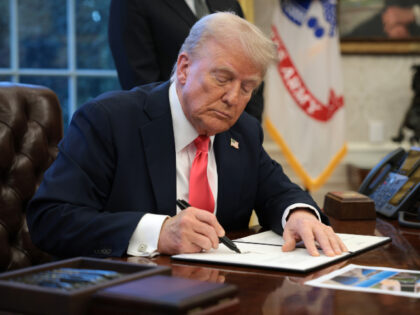 WASHINGTON, DC - FEBRUARY 25: U.S. President Donald Trump signs an executive order in the